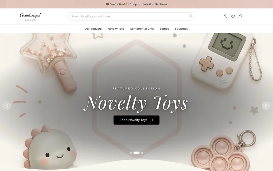 The Greetings! online shop homepage: blush pink banner, script logo and novelty toys for sale.